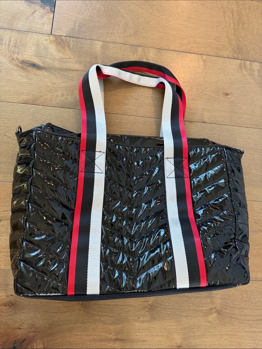 THINK ROYLN Black Quilted Gloss Tote with Red, White & Black Striped Handles